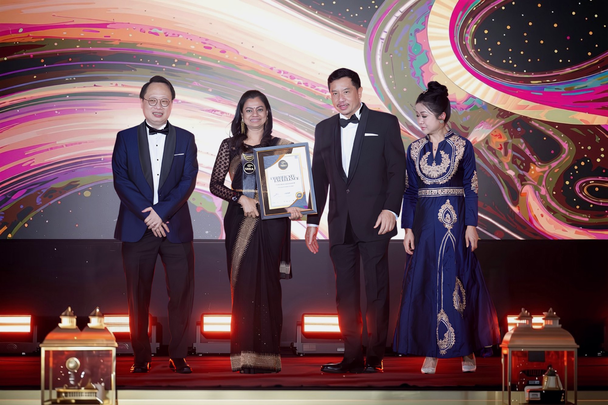 Proforall leadership receiving a certificate and trophy at an award ceremony